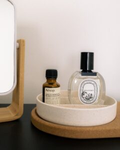 Luxury toiletries sit in a minimalist vanity setup.